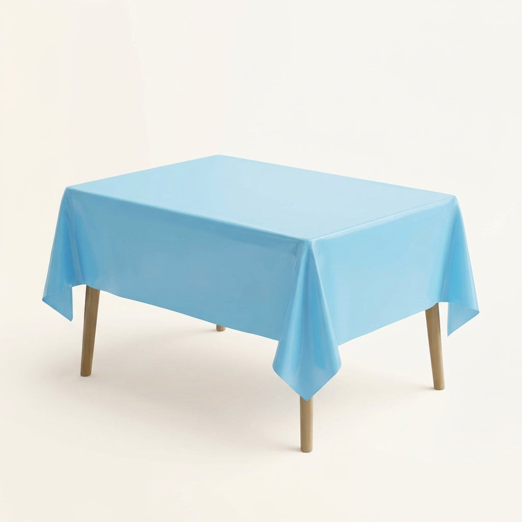 Light blue plastic party table cover on a rectangular table against a plain background
